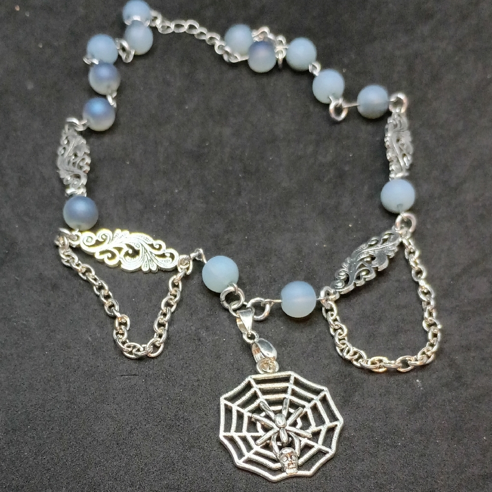 Silver and Blue Beaded Necklace with Spider Web Pendant